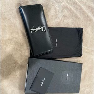 YSL large black leather zip wallet.  In great condition.